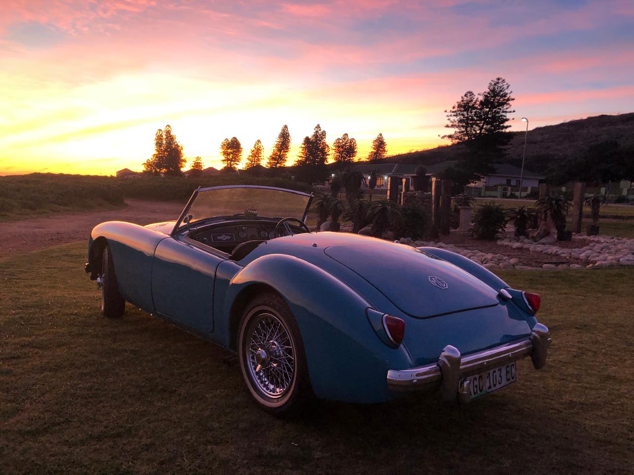 The MGA photographed from the rear three-quarter at sunset